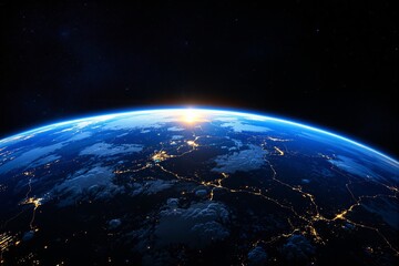 Fototapeta premium Sunrise over Earth from space with illuminated cities and glowing atmosphere.