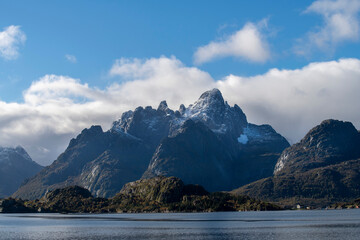 View over Raftsundet waters near Hadsel, Norway and entrance toTrollfjord (Trollfjorden) with mountains covered in first dusting of snow on Lofoten island chain archipelago