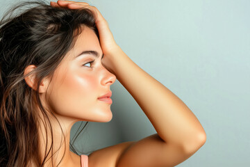 Fototapeta premium Profile Portrait of a Young Woman with Natural Beauty, Highlighting Her Radiant Skin and Elegant Features