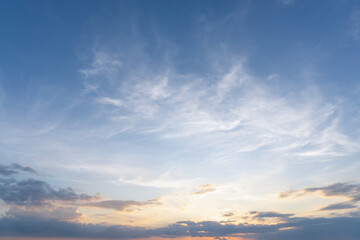 Beautiful morning or evening blue and orange sky with cloudy while sunsets or sunrises taken at the sea used as natural blackground texture