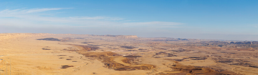 Panoramic view of Makhtesh (crater) Ramon - a geological relief of a large erosional cirque in the Negev Desert, southern Israel. January 17, 2025.