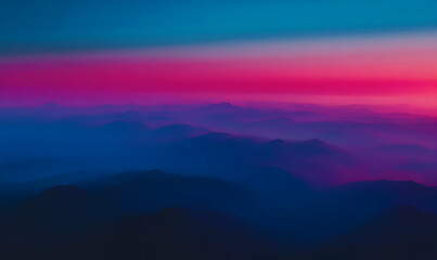 Obraz premium Serene sunset over majestic mountains, vibrant pink and blue hues paint the sky and landscape. Perfect for travel, nature, and tranquility themes.
