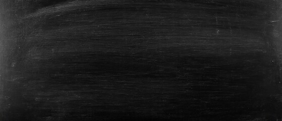 Fototapeta premium Blank dark blackboard with slight texture and faint scratches clean slate background for educational settings ideal for teaching and problem-solving no text or markings. Made with generative AI