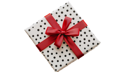 Gift box wrapped with dotted paper and a red ribbon on a white background. isolated background.