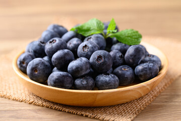 Blueberries on wooden plate, Healthy fruit, Food ingredient