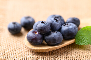 Blueberries in wooden spoon, Healthy fruit, Food ingredient