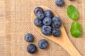 Blueberries in wooden spoon, Healthy fruit, Food ingredient, Table top view