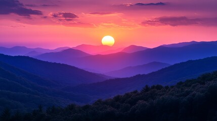 Fototapeta premium A Vibrant Sunset Over Misty Mountain Ranges with Layered Hues of Purple and Orange Creating a Serene and Majestic Landscape