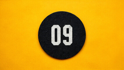 Number 09 Graphic Design: Black Circle with White Digits on Yellow Background, Modern Numerals Art, Round Icon, Bold Typography