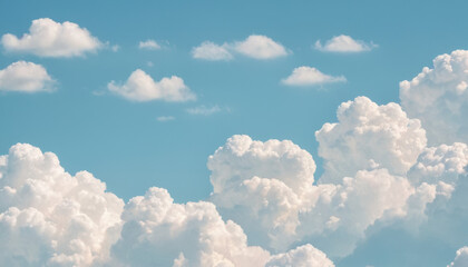 Fluffy white clouds in a bright blue sky with scattered small clouds