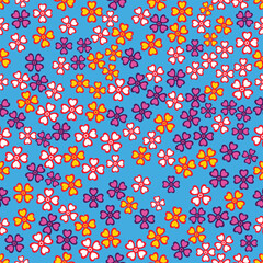Flowers scattered on a seamless blue background.
