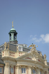 Fototapeta premium Beautiful old architecture of University of Muenster building top part with a green tower in elegant style, Münster, Germany