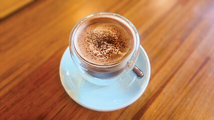 cup of coffee on wooden table