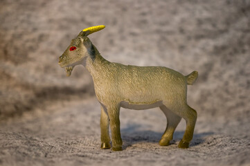Closeup of a toy figurine of a goat
