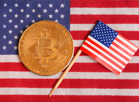 bitcoin coin on the background of the us flag Concepts of the leader of crypto us