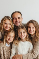 Fototapeta premium Happy family enjoying a moment together with smiles in cozy sweaters at home