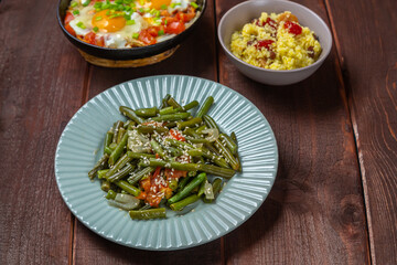 Jewish food tzimmes, chelnt, shakshuka and couscous with dried fruits