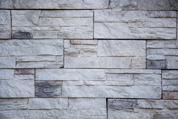 White light gray decorative brick stone wall texture or background for interior exterior decoration and industrial construction concept design