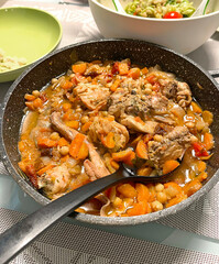 Braised rabbit with vegetables in pan. Food and healthy eating. Protein products. 