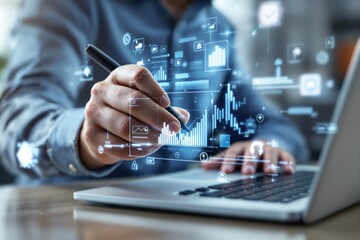 Businessman analyzing digital data graphs on futuristic interface with a pen over a laptop in a modern workspace.