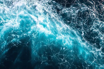 Fototapeta premium Turbulent turquoise ocean waves with foamy white highlights.
