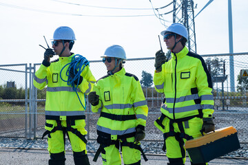 Engineers in safety gear at wind farm