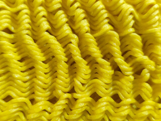 Dry instant noodles. Uncooked ramen noodles. Dry noodle background.