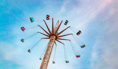 Attraction park. ride on a celestial carousel against the  sunset sky. © MARINA