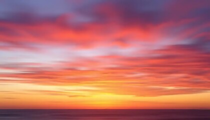 Obraz premium Vibrant Sunset Colors Over Ocean Horizon