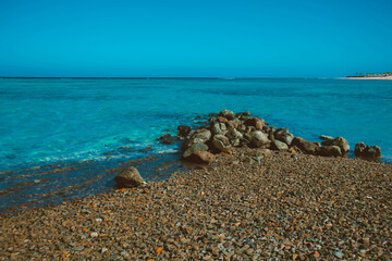 Rocks and corals in sea blue water. Landscape of Egypt on vacation