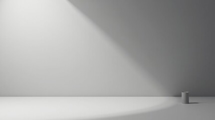 Minimalist gray room with single cylinder object and dramatic lighting