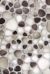 Background of stones close-up. Texture of stones and concrete