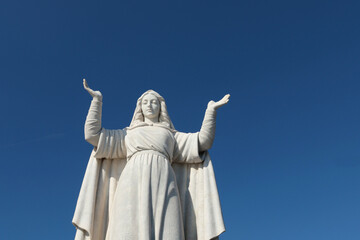 Fototapeta premium Santa Margherita, Italy - November 13, 2024. Statue to on sky background. Tourism and recreation. Faith and religion. 