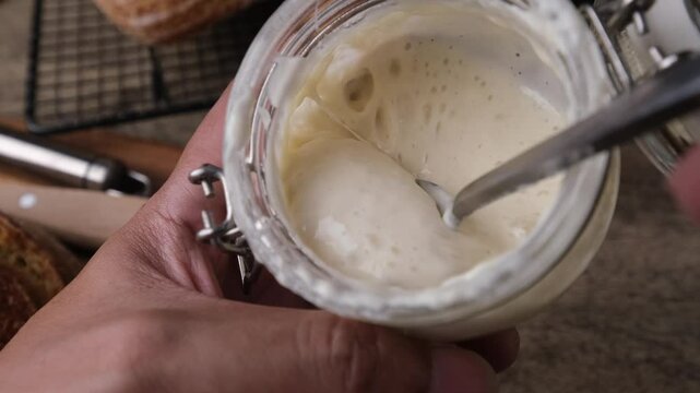 Fermenting Sourdough Starter Wild Yeast in a Kitchen Jar.