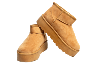 Pair of camel suede winter boots with platform sole and transparent background