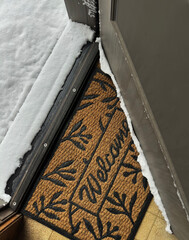 Changing weather as the door opens from inside to a look outside at winter white snow on the ground...