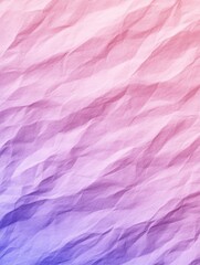 Fototapeta premium Wrinkled paper texture with gradient hues of pink and purple, offering a unique abstract background for creative design projects.