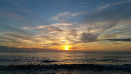 Golden Sunset over Calm Ocean Waves
