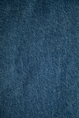 Close-up texture of blue denim fabric.  Perfect for backgrounds or textile designs.