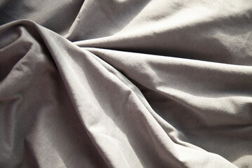 Obraz premium Soft, Draped Gray Fabric Texture. Subtle light and shadow create a luxurious feel.
