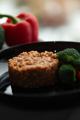 Hearty buckwheat groats served with broccoli and bell pepper. A healthy and delicious meal.
