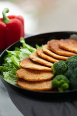 Golden-brown savory pancakes served with fresh broccoli and lettuce. A healthy and delicious meal!