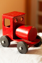 Vintage red wooden toy train, charming and nostalgic. Perfect for childhood memories, vintage themes, or playful imagery.