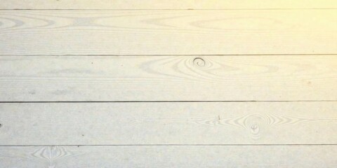 Naklejka premium Light-Colored Wooden Planks Showing Natural Grain and Texture with Subtle Warm Lighting