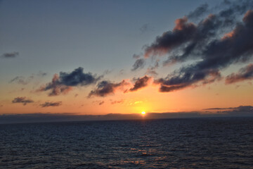 Naklejka premium Nordic Ocean Sunrise of the coast of Norway from boat, Summer 2024, Scandinavia, Europe. 