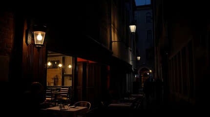 Obraz premium Dark alleyway with restaurant at night.