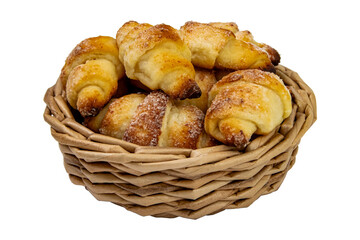 Freshly baked croissants arranged in a woven basket on a white background showcasing their golden brown color and flaky texture, isolate on white.