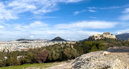 Athens, Greece. Parthenon, Acropolis hill and mount Lycabettus view from Areopagus hill