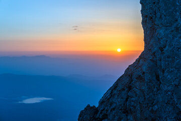 The Sunset Seen Through the Rocks, A Beautiful View