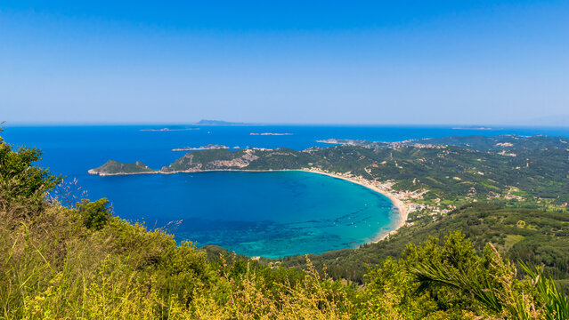 Panoramic view of Agios Georgios Pagon bay with Afionas village and Porto Timoni beach on cape, Corfu island, Greece